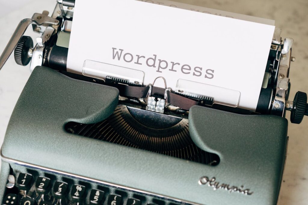 pexels-photo-4152505 Close-up of a vintage typewriter with a paper displaying 'Wordpress' in retro style.